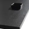 A close-up shot of a black, textured surface with a small black bowl on it. Náhled obrázku produktu