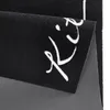 A close-up view of a black kitchen runner with white cursive text. Anteprima dell’immagine prodotto