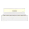 A white bed frame with integrated storage drawers and a lighted headboard. Produktbild-Vorschau