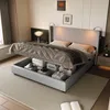 A bedroom scene with a bed that has storage underneath, showing it in a real-world setting.