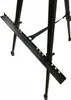 A close-up view of the lower section of a black metal easel. Podgląd zdjęcia produktu