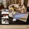 A family is relaxing in their living room while a robot vacuum cleans the floor. Produktbild-Vorschau