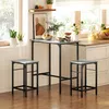 A kitchen or dining area with a bar table and two stools. Produktbild-Vorschau