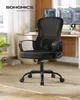 An office chair is shown in a home office setting with a desk and computer monitors in the background. Produktbild-Vorschau