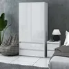 A modern bedroom or living room setting with a white wardrobe, a beanbag chair, and a bedside table with a lamp. Produktbild-Vorschau