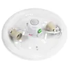 The inside of a white ceiling light fixture with a motion sensor and two E27 bulb sockets. Produktbild-Vorschau
