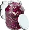 Two glass jars, one filled with chopped red cabbage and the other empty, with a white lid placed next to the filled jar. Podgląd zdjęcia produktu