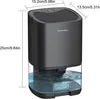 A black dehumidifier with a clear water tank is shown against a white background, with dimensions indicated by lines and text. Produktbild-Vorschau