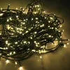 A tangled pile of green wire with many small, white LED lights. Produktbild-Vorschau