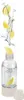 A soda maker with lemons splashing into it, against a white background. Produktbild-Vorschau