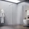 A modern bathroom with a walk-in shower, toilet, and bathrobe. Produktbild-Vorschau