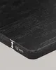 Close-up of the edge of a black wooden shelf with a measurement indicator. Produktbild-Vorschau
