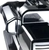 A close-up, angled view of a shiny, metallic pasta maker. Podgląd zdjęcia produktu
