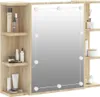 A wooden cabinet with a mirror and shelves, displaying various cosmetic products. Náhled obrázku produktu