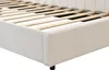 Close-up view of the side and slatted base of a beige upholstered bed frame. Náhľad obrázku produktu