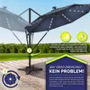 An outdoor patio scene with a large navy blue umbrella, demonstrating its 360-degree rotation feature. Voir les images du produit