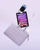 A laptop bag, tablet, smartphone, and stylus are arranged in a floating composition against a light purple background. Náhľad obrázku produktu