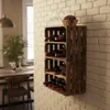 A wooden wine rack made of crates, filled with wine bottles, is mounted on a brick wall in a room with a dining table and chairs visible in the background. Náhled obrázku produktu