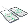 Two smartphones are wirelessly charging on a dual wireless charger. Produktbild-Vorschau