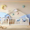 A child's bedroom with a white house-shaped bed, decorated with moon and star wall art. Podgląd zdjęcia produktu