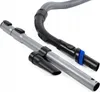 Vacuum cleaner attachments, including a curved handle with a hose and a telescopic tube with a crevice tool and a brush attachment, are displayed against a white background. Podgląd zdjęcia produktu