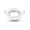 A white recessed spotlight housing with silver spring clips is shown against a white background. Voir les images du produit
