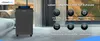 A dark gray dehumidifier is shown in a modern living room setting, with text overlays highlighting its features. Produktbild-Vorschau