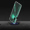 A clear phone case is shown on a dark background, with debris flying around it, suggesting it is protecting the phone from impact. Produktbild-Vorschau