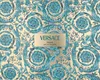 A close-up of a patterned box with the brand name and product details printed on it. Produktbild-Vorschau