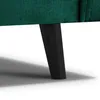 A close-up view of the leg of a green sofa. Produktbild-Vorschau