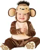 A baby wearing a monkey costume, sitting and clapping. Anteprima dell’immagine prodotto