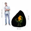 A man stands next to a bean bag chair with a dinosaur graphic. Náhľad obrázku produktu
