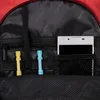 Close-up view of the inside of a red backpack, showing various compartments and items. Anteprima dell’immagine prodotto