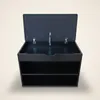 A black shoe cabinet with a dark blue upholstered lid open, revealing a storage compartment and two open shelves below. The cabinet is shown from the front with a slight upward angle. Náhľad obrázku produktu