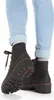 A close-up view of a person wearing black lace-up boots and light blue jeans. Produktbild-Vorschau