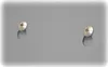 A close-up view of two screws on a gray surface. Produktbild-Vorschau