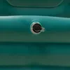 A close-up of an inflatable valve on a teal-colored bathtub. Náhled obrázku produktu