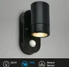 A black outdoor wall light with a motion sensor is mounted on a textured gray wall. Icons and text describing features are visible at the bottom. Produktbild-Vorschau