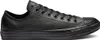A single black leather Converse Chuck Taylor All Star low-top sneaker shown from the side against a white background. Náhled obrázku produktu