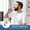 A man drinking water next to a product bottle. Produktbild-Vorschau