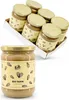 A close-up of a single jar of tahini in the foreground, with a tray of six jars in the background. Produktbild-Vorschau
