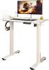 A white electric standing desk with a monitor, keyboard, and headphones. Produktbild-Vorschau