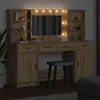 A vanity table with LED lights and a stool in a dimly lit room. Náhled obrázku produktu