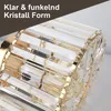 Close-up of a crystal ceiling light fixture with gold accents. Produktbild-Vorschau