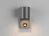 A modern wall lamp mounted on a gray wall. Produktbild-Vorschau