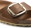 Close-up of a Birkenstock sandal strap with a large buckle. Podgląd zdjęcia produktu