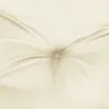 A close-up view of a cream-colored tufted cushion. Produktbild-Vorschau
