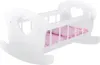 A white wooden rocking crib for dolls with pink bedding. Produktbild-Vorschau
