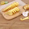 A wooden cutting board with spiral-cut potatoes on skewers, a whole potato, and kitchen tools for making potato chips. Náhled obrázku produktu