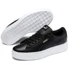 A pair of black Puma Vikky Stacked L sneakers with white soles, shown from a slightly elevated side angle. Anteprima dell’immagine prodotto
